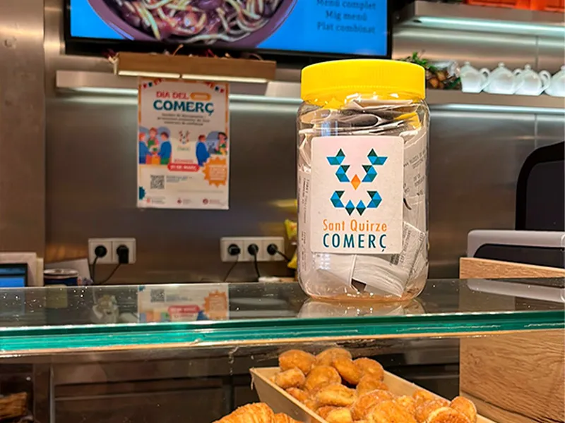 Cartell del Dia del Comerç 2026 a Sant Quirze amb promocions i descomptes als comerços locals